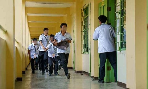 Students at Davao City National High School (DCNHS) rush through a campus hallway during the Nationwide Simultaneous School Safety Drill. Representing Region XI, the school partnered with local emergency response agencies to test its preparedness, coordination, and rapid evacuation mechanisms.