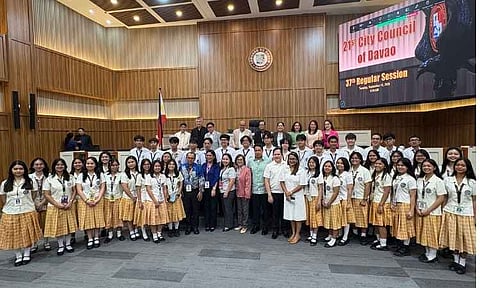 Officials and students from the Philippine Science High School – Southern Mindanao Campus (PSHS-SMC) stand alongside members of the Davao City Council during its 37th Regular Session on Tuesday, Sept. 15, 2026. The city local government unit formally commended the campus for ranking first nationwide among 208 participating schools in Mathematics, Science, and Reading in the 2025 Programme for International Student Assessment (PISA).