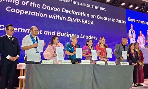 Government and business leaders hold copies of the signed Davao Declaration on Greater Industry Cooperation within BIMP-EAGA during the BIMP-EAGA Forum 2026 at the SMX Convention Center in Lanang, Davao City, on September 17, 2026. Co-organized by the Mindanao Development Authority (MinDA) and the Davao City Chamber of Commerce and Industry, Inc. (DCCCII) as part of the ASEAN Innovation Summit 2026, the signed declaration affirms a shared commitment to turn the sub-regional Vision 2035 policy framework into concrete market investments and cross-border project implementations.