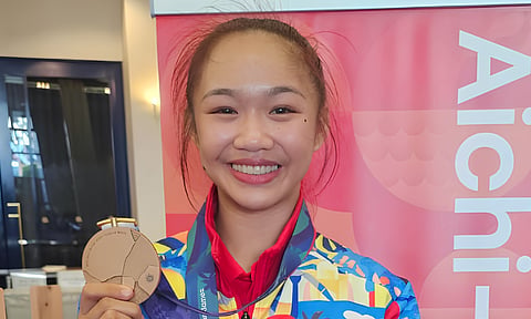 BRONZE ON DEBUT. Philippine karateka Marie June Adriano shows her bronze medal after winning the women’s kumite -50kg division at the 20th Asian Games in Toyohashi, Japan, Wednesday, Sept. 23, 2026. Adriano defeated Chinese Taipei’s Ya-chi Chung, 10-3, to secure her first Asian Games medal.