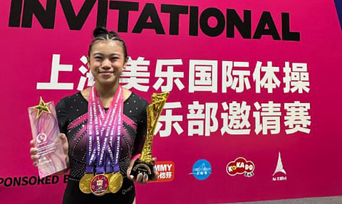 INTERNATIONAL CHAMPION. Davao City gymnast Zoey Jhanine Sangutan poses with her medals and trophy after winning the individual all-around title and four gold medals in women’s artistic gymnastics at the 2025 Shanghai Gymnastics Club Invitational in Shanghai, China.