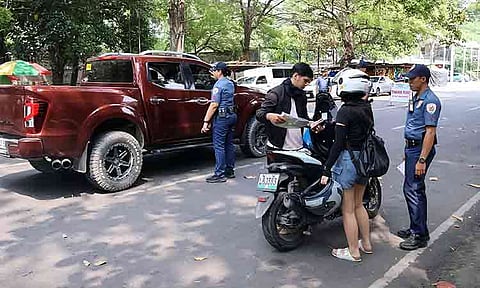 POLICE VISIBILITY. Police officers inspect a motorist’s documents during an on-the-spot inspection and correction (OTSIC) operation along Quirino Avenue in Davao City on Monday, Sept. 21, 2026. The Davao City Police Office said the operation is part of intensified police visibility in key areas to promote compliance, maintain order, and deter crime. The heightened presence also comes amid recent security concerns in the region, prompting police to strengthen monitoring and public safety measures.