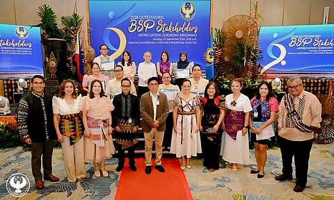 RECOGNIZING PARTNERS: Bangko Sentral ng Pilipinas Monetary Board Member Romeo L. Bernardo (top row, center) and Deputy Governor Bernadette Romulo-Puyat (top row, fourth from left) lead the recognition of the central bank’s outstanding stakeholders in Mindanao during an appreciation ceremony in Davao City on Sept. 28, 2026. The ceremony honored six institutional partners for their contributions to BSP programs and advocacies.