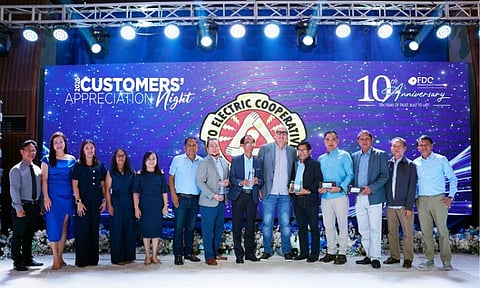 RECOGNIZING VALUED PARTNERSHIP. FDC Misamis Power Corporation recognized the Cotabato Electric Cooperative, Inc. (COTELCO) as its top-performing electric cooperative during its 10th Anniversary Customers' Appreciation Night. COTELCO delegates, led by (8th from left) Board Vice President Romeo Torres, received the honor from (9th from left) FDC Misamis President and CEO Juan Eugenio Roxas.