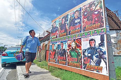 DAVAO. Candidates running for post in Barangay 16-B in Davao City cropped their faces into the superhero suits to catch the attention of passers-by. The Commission on Elections however cautioned against such as the candidates can be sued for copyright infringement. (Macky Lim)