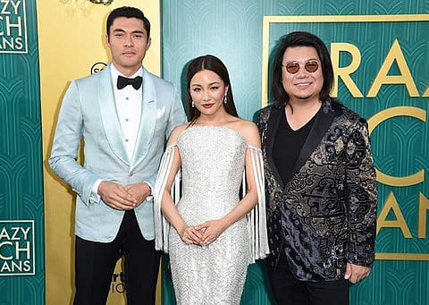 CALIFORNIA. Henry Golding, from left, Constance Wu and executive producer/author Kevin Kwon arrive at the premiere of "Crazy Rich Asians" at the TCL Chinese Theatre on Tuesday, Aug. 7, 2018, in Los Angeles. (Invision/AP)