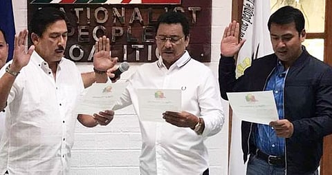 OATHTAKING. Senate President Vicente Sotto III leads the oath taking of former Senator Lito Lapid and son former Pampanga Gov. Mark Lapid, who are new members of the Nationalist People's Coalition (NPC), at the NPC Clubhouse in Quezon City. (Contributed photo)