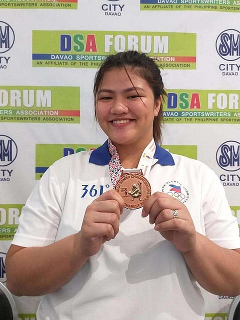 DAVAO. Sydney Sy Tancontian beams as she poses showing her World Sambo Championships bronze medal after guesting at the Davao Sportswriters Association (DSA) Forum at The Annex of SM City Davao yesterday. (Marianne L. Saberon-Abalayan)