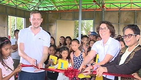 PAMPANGA. AWO International SEA regional director Jacob Littman leads the ribbon cutting and turnover of floating shelters to residents of Barangay Nigui, Masantol. (Contributed Photo)