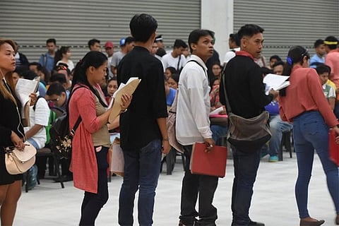 CEBU. Jobseekers lining up, waiting for their turn to be interviewed during the Labor Day job fair in SM City Cebu.