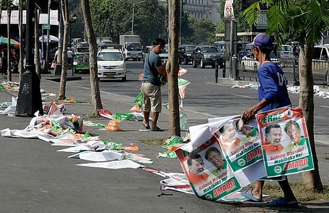 MANILA. Manila City public workers remove the campaign posters, mostly that of incumbent Mayor and former President Joseph "Erap" Estrada, around the Manila City Hall, a day after the country's midterm elections Tuesday, May 14, 2019 in Manila, Philippines. (AP)
