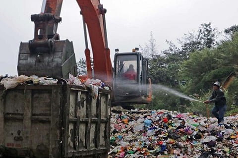 TRASH DEODORANT. Acting on the order of General Services Officer Eugene Buyucan, Marcos Highway Waste Transfer Station foreman Michael Innad sprays a chemical byproduct 6-10 times-a-day to ensure that all plastics and other non-biodegrable waste materials are disinfected and free from any foul smell to protect the health of residents and passing motorists in the area.