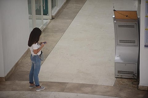 ILOILO. A visitor uses a cellphone on the lobby of the Provincial Capitol on Friday, September 13, 2019. Capitol employees are ordered to minimize the use of cellphone in the Capitol. (Leo Solinap)