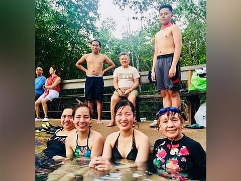 PALAWAN. Soaking in Maquinit Springs fringed with lush mangrove trees are: Gheni, Hikari, Miho, and the author. Behind are: Walter, Rey, and Wayne. (Debb Bautista)