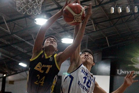 MIDAIR COLLISION. BCT's Lito Villanueva and SLU's Justin Paul Madriaga battles for the rebound during their eliminations match–up at the UC gym in the ongoing men's basketball of the Baguio – Benguet Educational Athletic League season 33. (Photo by Roderick Osis)