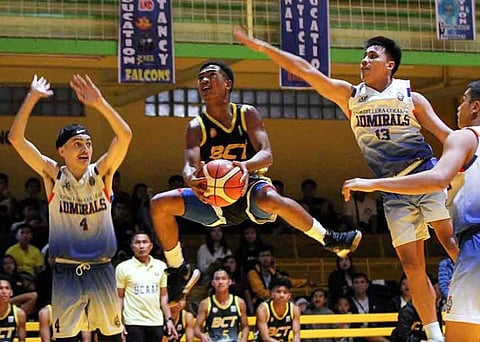 CHALLENGED. BCT Atoms' Timothy Miley Jr. tries to bank a two pointer against CCDC Admirals Peter Sarris and John Russel Tuazon during their step ladder semis match at the CCDC gym. (Photo by Jean Nicole Cortes)