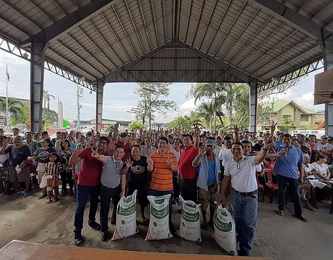 PAMPANGA. PhilRice provincial coordinator Paul Marcelo, board member Pol Balingit, Rep. Juan Pablo "Rimpy" Bondoc, Mayor Abundio Punsalan, Jr. and municipal agriculture officer Eleazar Santos lead the distribution of certified seeds to Simonian farmers. (Princess Clea Arcellaz)