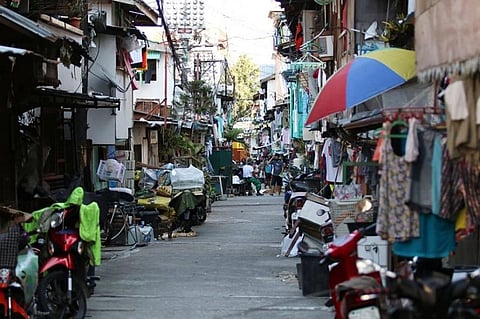 LOCKDOWN. Officials of Barangay Luz, Cebu City have locked down Sitio Zapatera following information from the Department of Health that three of its residents tested positive for Covid-19. (Photo by Alan Tangcawan)