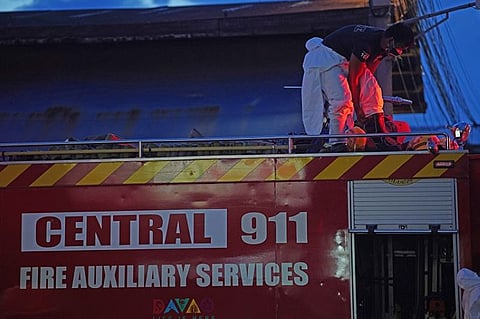 DAVAO. Fireman of Davao City Central 911 wears his protective suit on board a fire engine in preparation for the cleaning of Agdao Public Market in Davao City. Agdao, together with other markets, follows regular cleaning and disinfection schedules to ensure the safety of Dabawenyos.