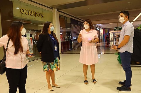 INSPECTION. Executive Assistant IV Reina Manuel, with Angeles City Economic Development and Investment Promotions Officer In Charge, Irish Bonus Llego inspect the area inside SM City Clark where the city government will stage an exhibit on December 17 to 20, 2020 showcasing locally-made products of Micro, Small, Medium Enterprises (MSMEs) displayed at the One Town One Product store. (Angeles City PIO)