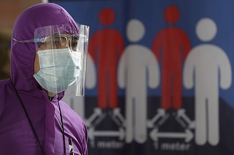 MANILA. In this photo taken in August 2020, a worker at a train station wears a protective suit to help curb the spread of Covid-19 in Quezon City, Metro Manila. (File)