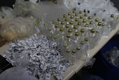 Drugs seized during a police raid are displayed for the press at the city police headquarters in Rio de Janeiro, Brazil, Thursday, May 6, 2021. At least 25 people died during the raid, including one police officer and 24 suspects, according to the press office of Rio's civil police. (AP Photo/Silvia Izquierdo)