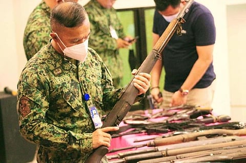 UNLICENSED GUNS. The government recovers 314 loose firearms, as it expands the implementation of the Small Arms and Light Weapons program to Tawi-Tawi. A photo handout shows Police Colonel Bonard Briton, Tawi-Tawi police director, inspects one of the 70 loose firearms that were surrendered in two Tawi-Tawi towns. (SunStar Zamboanga)