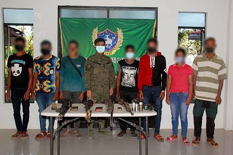 ZAMBOANGA. Seven New People's Army (NPA) rebels surrender around 10 a.m. Sunday, October 17, to the troops of the 7th Infantry Battalion (IB) at the Old Provincial Capitol in Kalawag II village, Isulan, Sultan Kudarat. A photo handout shows the seven former NPAs together with Lieutenant Colonel Romel Valencia, 7IB commander, in a souvenir picture after they surrendered. (SunStar Zamboanga)