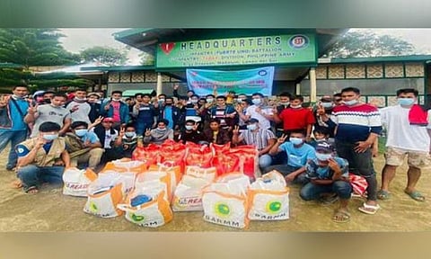 ZAMBOANGA. Thirty supporters and couriers of the Dawlah Islamiya-Maute Group (DI-MG) surrender to military on Friday, March 4, three days after troops captured the DI-MG lair in Ilalag village, Maguing, Lanao del Sur. A photo handout shows the surrenderers in a group photo after they received food packs from the Bangsamoro Autonomous Region in Muslim Mindanao. (SunStar Zamboanga)