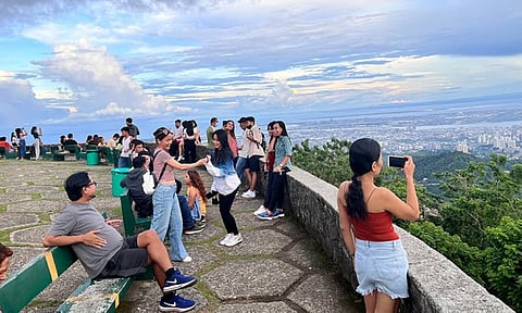 TOPS TO SAY GOODBYE. Several tourists flock to the Tops Lookout, popularly known as "Tops," in Barangay Busay, Cebu City on Saturday, Oct. 1, 2022, ahead of its temporary closure on Oct. 21. The iconic tourist destination is set to be closed to the public to make way for its redevelopment by two private firms. Before its closure, the operators of Tops has launched several promotions to reintroduce the site. (Photo by Katlene Cacho-Onrejas)