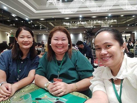 Day of Research Presentation. (From left) Dr. Liza Floresca, Apple Guiao Alvarez, and Grace Guitguiten