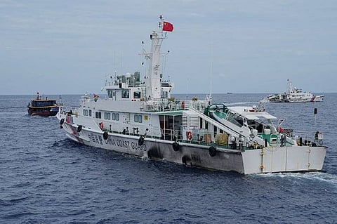 MANILA. A Chinese coast guard ship tries to block the way of a Philippine supply boat (left) as it heads towards Second Thomas Shoal, locally known as Ayungin Shoal, at the disputed South China Sea on August 22, 2023. (AP)