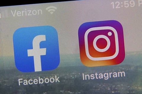FILE - A view of the mobile phone app logos for, from left, Facebook and Instagram in New York, Oct. 5, 2021. Meta plans to give European Facebook and Instagram users the option of paying for ad-free versions of the social media services as a way to comply with the continent’s data privacy rules, the Wall Street Journal reported on Tuesday, Oct. 3, 2023. (AP Photo)