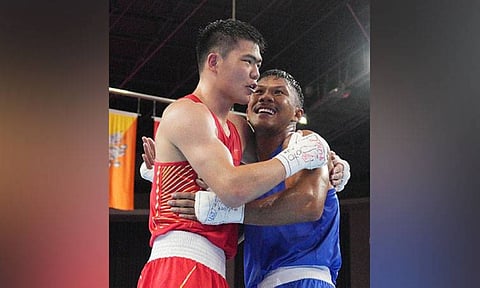 Eumir Felix Marcial from the Philippines (right) and China’s Tuohetaerbieke Tanglatihan embrace at the end of the men’s 71-80Kg boxing final at the 19th Asian Games in Hangzhou, China, Thursday, Oct. 5, 2023. Marcial lost to Touhetaerbieke. / AP