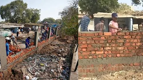 ‘ട്രംപിന് മുന്നില് നാണക്കേട്’, ഗുജറാത്തിലെ ചേരികള് മതില്കെട്ടി മറയ്ക്കുന്നു, സുരക്ഷയ്ക്കെന്ന് വിശദീകരണം