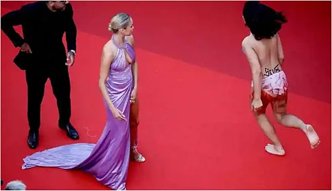 'ഞങ്ങളെ ബലാത്സംഗം ചെയ്യുന്നത് നിര്ത്തൂ'; കാന്സ് ഫെസ്റ്റിവലില് വസ്ത്രങ്ങള് ഊരിയെറിഞ്ഞ് സ്ത്രീയുടെ പ്രതിഷേധം