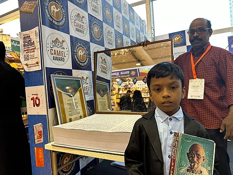 തലതിരിച്ചെഴുതി താരമായി എട്ടുവയസുകാരന് ആദിഷ്