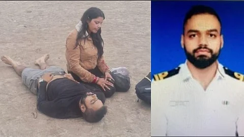 ഭർത്താവിന്റെ മൃതദേഹത്തിനരികെ വിറങ്ങലിച്ചിരിക്കുന്ന യുവതി; ഉള്ളുലച്ച ആ ചിത്രം കൊച്ചിയിലെ നാവികസേന ഓഫീസറുടേത്