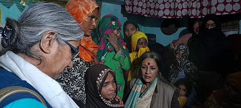 Vrinda Karat and other members of the CPI delegation speaking to the aggrieved family members.
