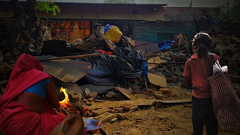 Remains of demolished shanties in Dhaula Kuan
