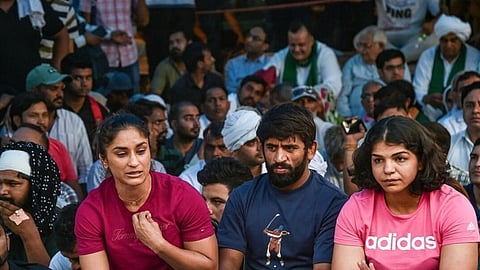 wrestlers at protest site.