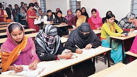Representative image of women from different communities studying