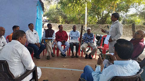 Manoj Gautam motivates the volunteers outside his home in mijhauna village of Jalaun
