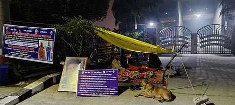 Students staging sit-in protest outside the main gate of the University building.