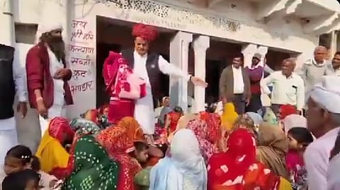 The video shows Singh distributing blankets among a group of women. When he found few of them to be Muslims, he refused to give blankets to them.