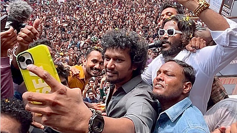 Director Lokesh Kanagaraj taking selfie with a group of fans