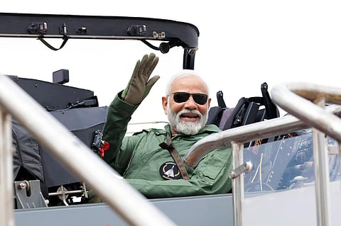 PM Modi seated in Tejas