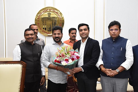 Revanth Reddy with Karan Adani and other members of the contingent