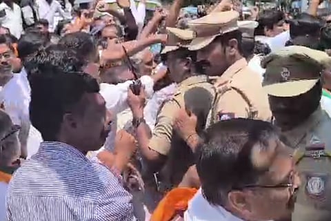 Party cadres clashing outside the nomination centre in Ooty