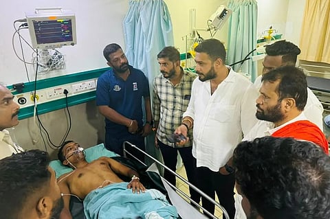 The victim lying on a hospital bed